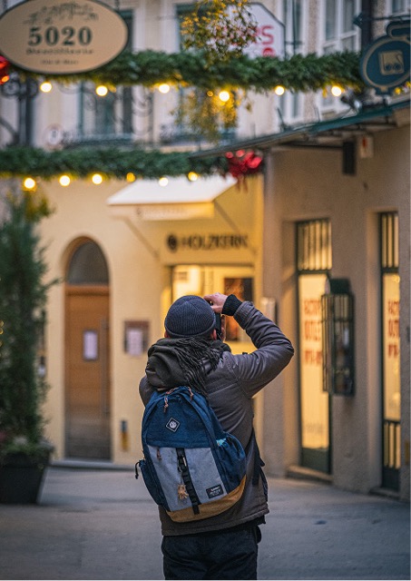 A person capturing a photograph.