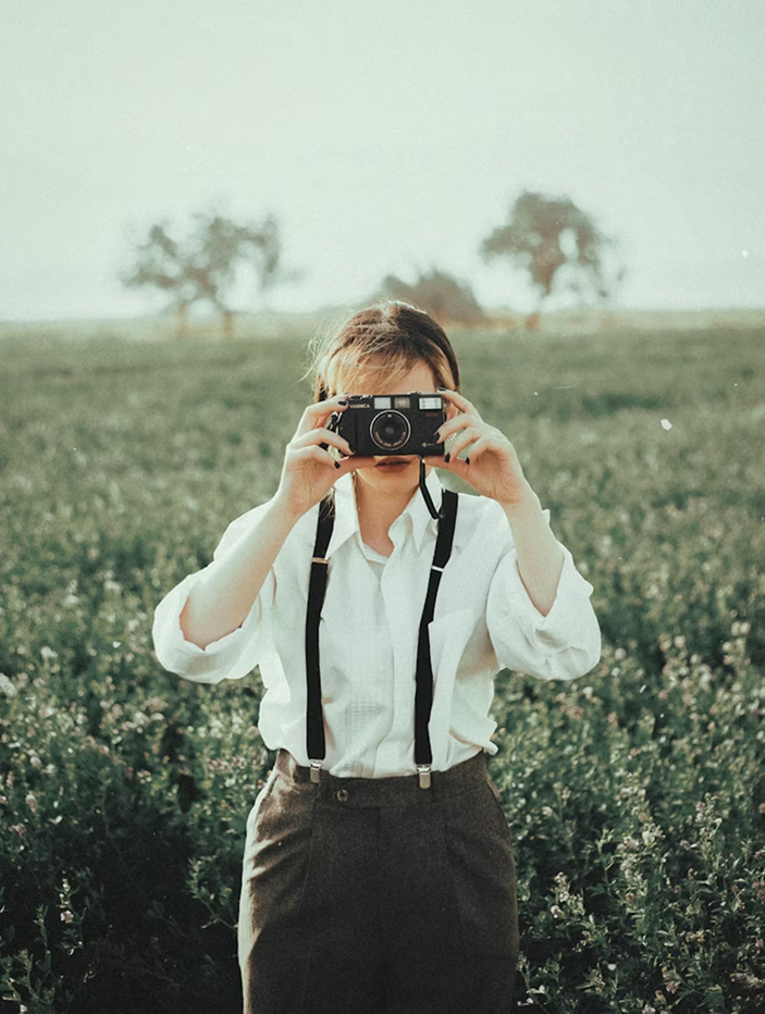 A person capturing a photograph.